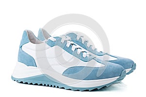 Pair of blue sneakers isolated on white