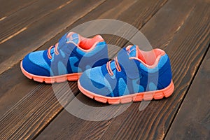 Pair of blue sporty shoes for kid