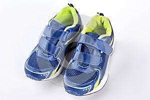 Pair of blue trainers on white background.