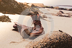 Pair of boots on the beach