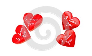 Pair of bright red hearts on white background