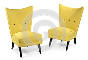 Pair bright yellow soft chairs isolated on white
