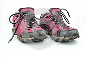 Pair Broken trek,use, outdor pink shoes on a white background