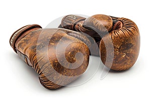 Pair of brown boxing gloves isolated on white background. Concept of boxing equipment, combat sports gear, training
