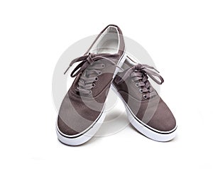 A pair of brown canvas shoes isolated on white