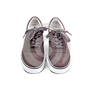 A pair of brown canvas shoes isolated on white