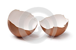 Pair of brown empty egg shells close up on white background