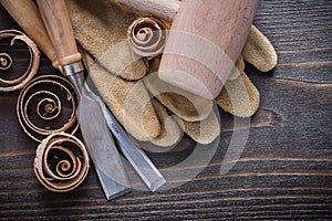 Pair of brown leather gloves firmer chisels wooden mallet and cu