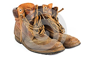 Pair of brown leather work boots on white