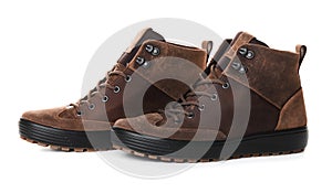 Pair of brown male boots isolated over white background