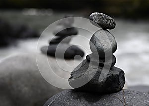 A pair of cairns by the river