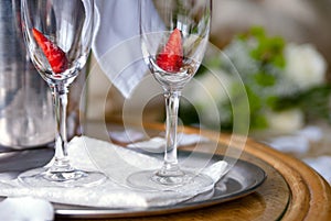 Pair of champagne glasses with strawberry inside