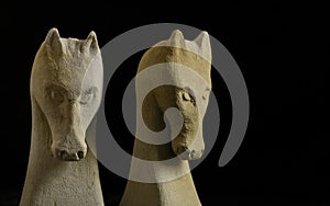 Pair of chess horses carved in stone