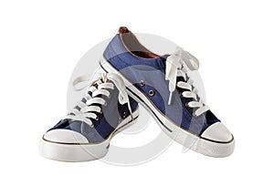 Pair of classic blue sneakers or gumshoes with white shoe laces isolated on white background. Comfortable shoes for fitness and