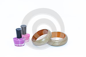 Nail polish bottles and green wooden bangles