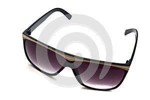 A pair of dark sun shades glasses for ladies white backdrop