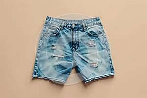 A pair of denim shorts in a vibrant blue color, featuring stylish distressing with intentional holes for a casual, edgy