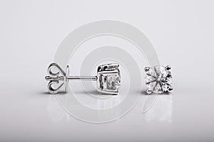 Pair of Diamond and white gold stud earrings on white background