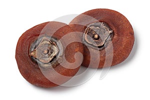 Pair of dried kaki persimmon on white background close up