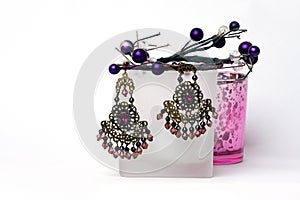 Pair of earrings on white background