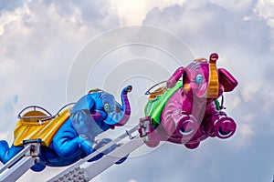 Pair of elephants are a fun thrill ride for kids