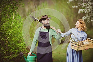 A pair of farms working in the garden. I like spending time on farm. Smile Couple on farmland. Farmars couple enjoy