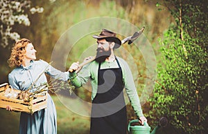 A pair of farms working in the garden. I like spending time on farm. Smile Couple on farmland. Farmars couple enjoy