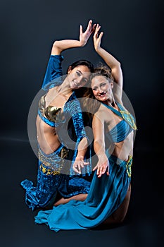 Pair of female belly dancers photo