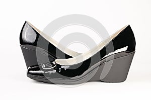 Pair of female black varnish shoes