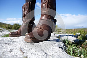 Pair of female brown leather boots