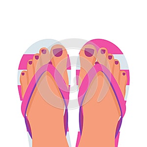 A pair of female legs with a pedicure in beach slippers. Beach shoes.