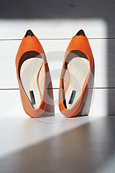 Pair of female summer shoe.orange girls shoes without heels