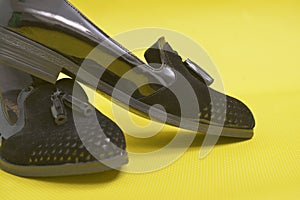 Pair of female  summer shoe on yellow background