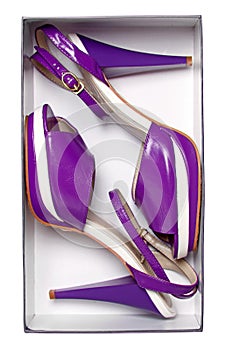 Pair of female violet summer shoes in box