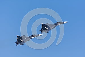 Pair of fighters flying in tight formation photo