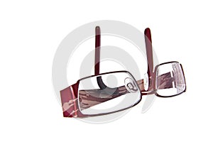 A pair of folded eye glasses