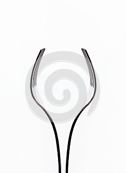 Pair of forks look like a wine glass. abstract minimalist composition