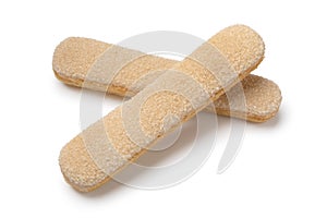 Pair of fresh traditional ladyfingers close up on white background