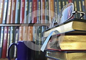 A Pair of Glasses on a Stack of Books