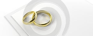 Two golden wedding rings isolated on white paper invitation, banner, copy space, 3d illustration