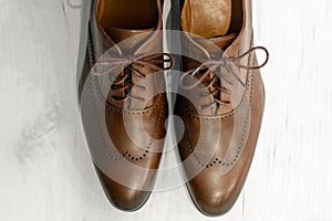 Pair of gorgeous expensive mens shoes made of genuine leather, with shoelaces, the item wedding groom suit