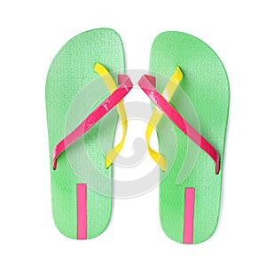 Pair of green flip flops isolated on white, top view