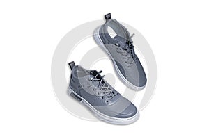 Pair of grey sneakers isolated on white background with clipping path.