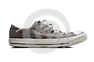 A pair of grey sneakers on white
