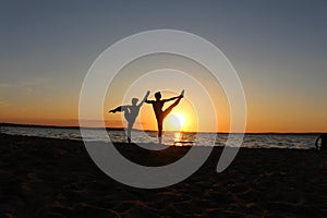 A pair of gymnasts athletes. Silhouette photo