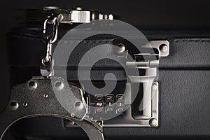 Pair of Handcuffs on Briefcase with 911 on Lock