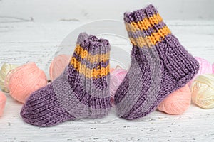 Pair of handmade woolen socks for newborn