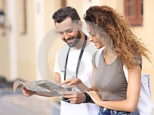 A pair of happy young tourists sightseeing in summer