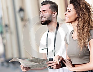 A pair of happy young tourists sightseeing in summer