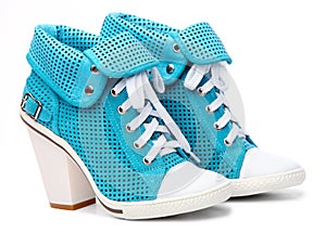 Pair of high-heeled turquoise female shoes